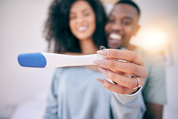 Image showing Pregnancy test, happiness and black couple in a home with a smile from baby news. Support, care and blurred background of a young and new mother and dad together feeling love with pregnant woman