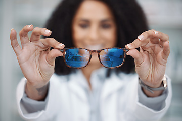 Image showing Optometry, vision and optometrist with glasses in a clinic to test and choose a prescription lens. Healthcare, eye care and pov of a female optician with spectacles or eyewear in a optical store.