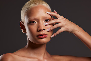 Image showing Makeup, hands on face and portrait of woman in studio for beauty products, cosmetics and skincare. Salon aesthetic, cosmetology and girl model for manicure, self love and beauty on gray background