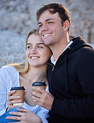 Image showing Morning coffee, couple and beach adventure of young people by the sea with happiness. Bonding, love and care of a man and woman together feeling happy on summer holiday outdoor with a smile