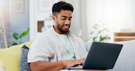 Image showing Laptop, laughing and man on couch watching funny video, live streaming or reading post on social media. Happy person relaxing on sofa with computer, internet and wifi in his apartment or living room