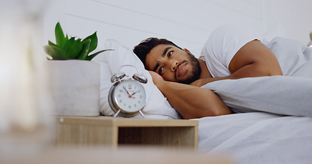 Image showing Stress, insomnia and man in bedroom, anxiety and depression with mental health problems. Male, guy and sleepless in bed, tired and overthinking with fatigue, alarm clock and frustrated with issues