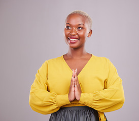 Image showing Happy woman, prayer and thinking of faith, religion and hope or thank you for career opportunity on studio background. Christian or African person namaste, gratitude emoji and vision for ngo business