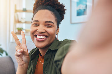 Image showing Woman, portrait and peace for selfie in home, smile and post live streaming vlog in living room. Face of happy african gen z, profile picture or show v sign with hand emoji for social media broadcast