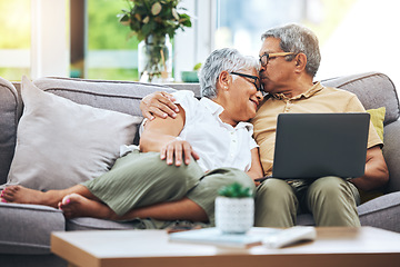 Image showing Laptop, love and senior couple on sofa for watching movies, entertainment or streaming in living room. Retirement, marriage and happy man and woman kiss on computer for bonding, relax or film at home