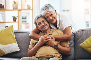 Image showing Portrait, hug and senior couple on sofa for bonding, healthy marriage and relationship in living room. Retirement, love and happy man and woman on couch embrace for trust, commitment and care at home