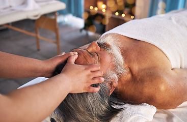 Image showing Facial, head massage and senior with man in spa for wellness, treatment and hospitality. Peace, cosmetics and salon with customer and masseuse in hotel for health, vacation and physical therapy