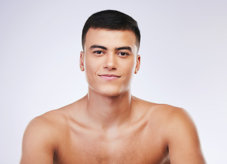 Image showing Man, beauty and face with skin, smile and grooming for hygiene and clean isolated on white background. Portrait, model and dermatology, skincare and treatment with cosmetics and wellness in a studio