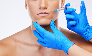 Image showing Man, syringe and lip filler surgery in studio with doctor for beauty, wellness or facial change by white background. Young model, needle and hands for mouth, cosmetic transformation and dermatology