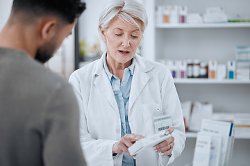 Image showing Senior woman, pharmacist and customer in consultation for medication or prescription at drugstore. Mature female person, medical or healthcare employee with patient and pharmaceuticals at pharmacy