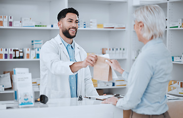 Image showing Happy man, pharmacist and paper bag for customer in consultation, medication or pills at pharmacy. Male person, medical or healthcare employee giving patient pharmaceutical products at drugstore