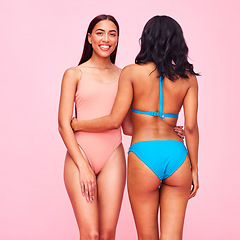 Image showing Bikini, fashion and portrait of friends with diversity, beauty and style of women in swimsuit on pink background in studio. Swimming costume, face and model hug with body confidence and support