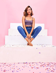 Image showing Portrait, steps and woman with confetti, style and fashion with celebration on a pink studio background. Person, gen z or girl with sparkle, party or event with confident model or birthday decoration