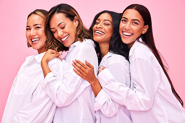 Image showing Women, friends hug and portrait in studio with natural beauty, diversity and white shirt with laugh. Pink background, bonding and young female group together with inclusion, happy smile and wellness