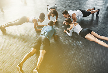 Image showing People, fitness and push up in class, group or circle for workout, training and community support. Exercise team, friends and athlete in gym for lose weight, sports and health or accountability above