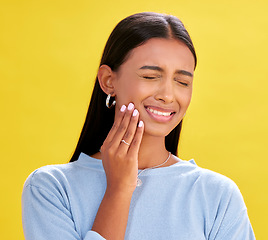 Image showing Dental, pain and woman in studio for toothache, problem and cavity crisis on yellow background space. Oral care, face and lady person with tooth, emergency or frustrated by sensitive teeth or decay