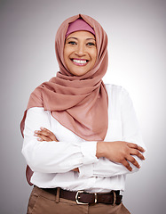 Image showing Muslim, arms crossed and portrait and woman in studio with happiness, style and positive attitude. Hijab, islam and islamic fashion with a person on grey background for business and confidence
