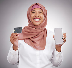 Image showing Muslim woman, credit card and phone screen in fashion e commerce, online shopping or advertising mockup in studio. Islamic person in excited portrait and mobile banking or payment on white background