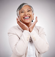 Image showing Portrait, hands and beauty of mature woman in suit in studio isolated on a white background. Face, makeup cosmetics and excited model with funny laugh in spa facial treatment for skincare antiaging