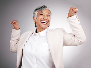 Image showing Strong, laughing and portrait of a woman on a studio background for a professional career. Happy, funny and a mature manager or employee showing power, muscle or confidence isolated on a backdrop