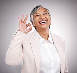 Image showing Business woman, happy and okay sign, success and support or like for Human Resources in studio portrait. Mature HR person or professional indian manager with yes emoji or excited on white background
