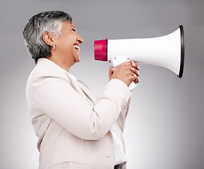 Image showing Business woman, megaphone and voice of news, broadcast or sale and announcement on a white background. Mature person, leader or happy speaker in noise, call to action and attention or deal in studio