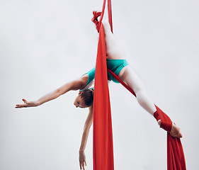 Image showing Aerial, woman gymnast and training performance with stretching, flexibility split and athlete with white background. Workout, exercise and gymnastics with balance art and dance acrobat competition