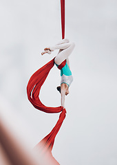 Image showing Aerial, woman gymnast and ribbon for sport performance with flexibility and athlete with white background. Workout, exercise and gymnastics with balance, art and dance with acrobat competition