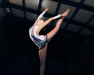 Image showing Fitness, stretching and performance with a dance woman in a gym for training or practice for a competition. Exercise, event and form with a female gymnastic or rhythmic dancer in a workout studio