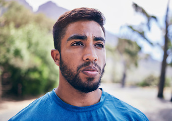 Image showing Face, sweating and sports man at park for fitness, training fatigue and focus on exercise. Tired indian runner, serious athlete or thinking of workout, challenge or break from cardio marathon outdoor