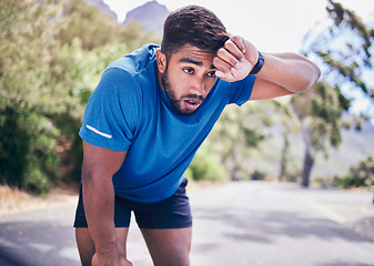 Image showing Man, tired and sweating for sports training, exercise break and workout challenge in nature park. Indian athlete, runner and breathe for fitness rest, outdoor running and fatigue of cardio marathon