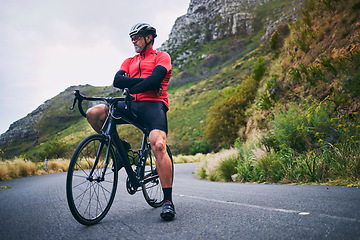 Image showing Fitness, cycling and thinking with man on bike in nature for sports, training and challenge. Exercise, workout and health with mature person on bicycle in mountains for energy, freedom or performance