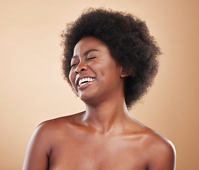 Image showing Black woman, laughing face and beauty in studio with skin care, dermatology and natural glow. Happy and funny African model person with afro hair, cosmetics and self love on a beige background