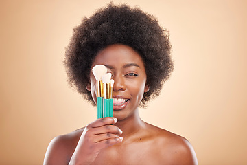 Image showing Portrait, makeup and a black woman with brushes on a studio background for wellness and foundation. Tongue out, beauty and an African person or model with product for facial cosmetics on a backdrop