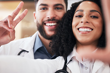 Image showing Pharmacy, peace sign and selfie portrait of pharmacists for social media, profile picture and clinic website. Healthcare, emoji and man and woman take photo for wellness, medicine and medical service