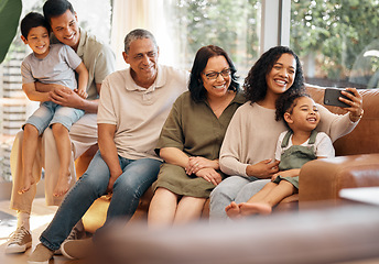 Image showing Happy family, selfie and grandparents and kids on sofa for holiday, love and relax together at home. Interracial people, mother and father with children in living room, profile picture or photography