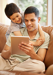 Image showing Happy father, kid and hug with tablet in home for online games, reading ebook story and elearning multimedia. Man, dad and boy child watch cartoon, movies or digital technology on sofa in living room