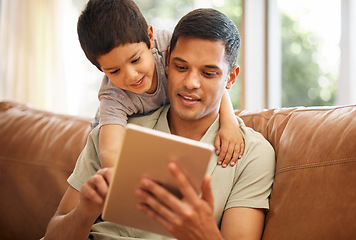 Image showing Father, boy and child with tablet on sofa for online games, reading ebook story and elearning multimedia. Man, dad and happy kid streaming cartoon, movies or digital technology in living room at home