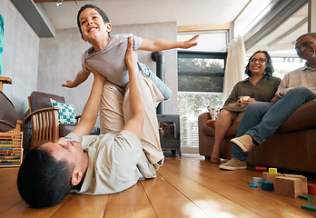 Image showing Airplane, love and boy child with father on a floor for playing, games and bond at home with grandparents. Flying, fantasy and excited kid with parent in living room for fun family time in a house