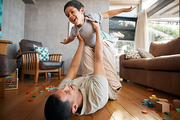 Image showing Child, father and airplane games in home on living room floor for support, happy together and crazy fun. Dad, boy and excited kid flying for freedom, fantasy and playing with balance, care and energy