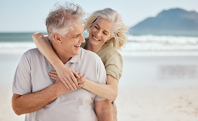 Image showing Hug, senior couple and outdoor at the beach with happiness, love and care on vacation. Man and woman on retirement holiday, adventure and romantic trip in nature to relax and travel with mockup