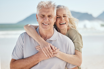 Image showing Hug, love and senior couple at the beach on a romantic vacation, adventure or weekend trip. Happy, smile and portrait of elderly woman and man in retirement embracing by ocean on holiday in Australia