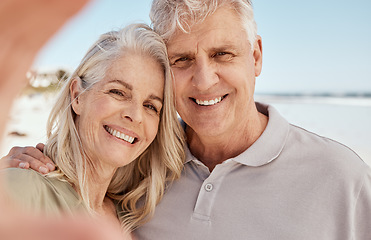 Image showing Old couple, selfie and smile in portrait on beach, love and travel with social media memory and wellness. Hug, smile in picture and trust, commitment and partner with marriage, retirement and holiday