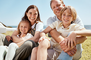 Image showing Portrait, family and happy on vacation at beach, bonding and relax together. Parents, children and mother with father at ocean, smile and having fun to travel on summer holiday outdoor at sea.