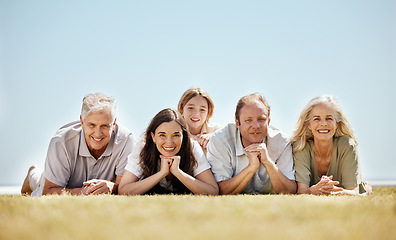 Image showing Family, generations and portrait, people outdoor on lawn with grandparents, parents and child. Happiness, people relax in nature while on vacation with mockup space, bonding with love and care,