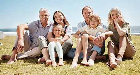 Image showing Portrait, big family and smile on vacation at beach, bonding and relax together. Grandparents, children and mother with father at ocean, happy or having fun to travel on summer holiday outdoor at sea