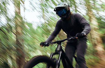 Image showing Bicycle, forest and man travel, speed and workout outdoor in woods for healthy body. Mountain bike, nature and athlete training, cycling blur and off road adventure on journey, freedom and fast sport