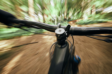 Image showing POV, mountain bike and person cycling in nature, park and forest for adventure, speed and motion blur. Closeup, perspective and bicycle handle for outdoor action, fast power and off road performance