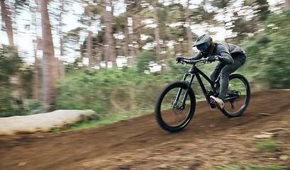 Image showing Bicycle, man in woods and speed blur in workout outdoor at forest for healthy body. Mountain bike, nature and fast athlete training, cycling or off road adventure in fitness, exercise or sport travel