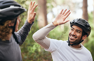 Image showing Forest, cyclist and friends with high five, support and exercise with fitness, smile and motivation. People, men and bikers with gesture, woods and challenge with progress, workout and achievement